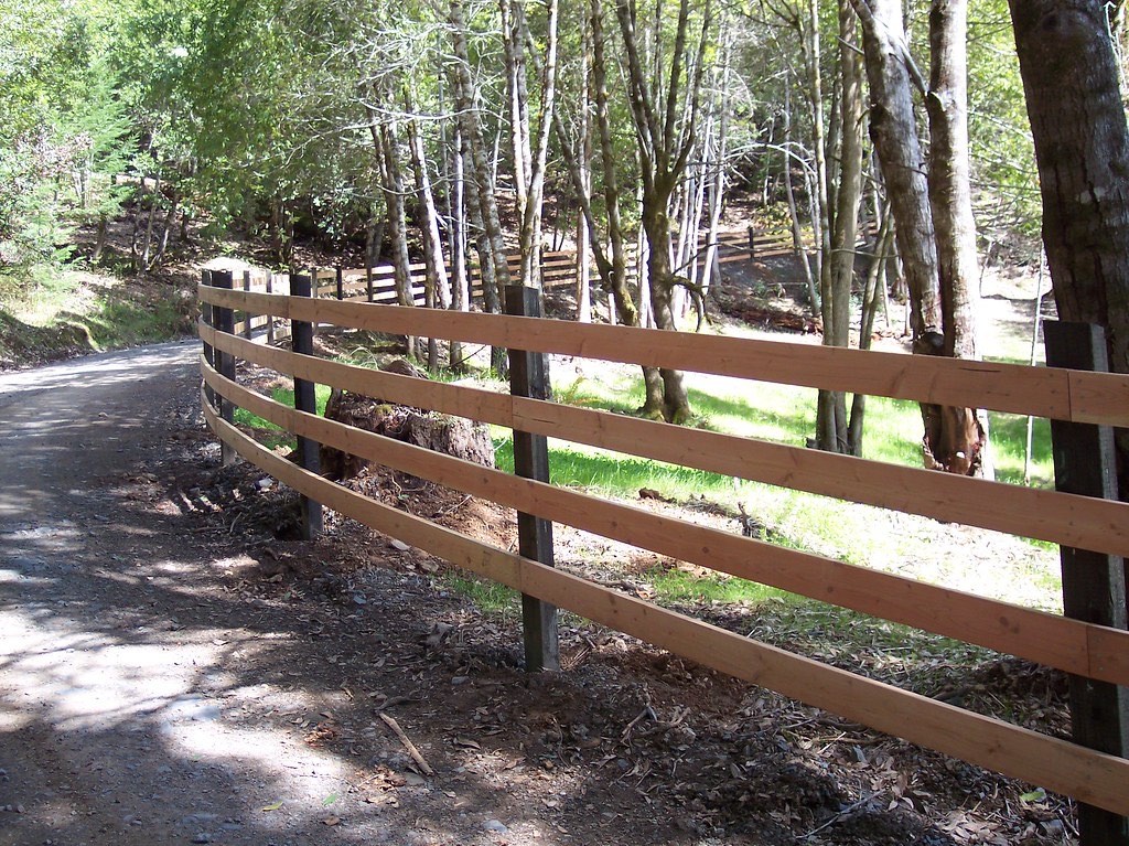 Example of wooden split-rail agricultural fence on a grassy Humboldt County hillside