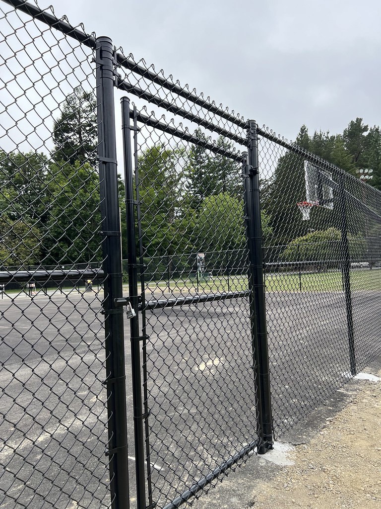 Heavy-gauge commercial chain link fence perimeter at a Humboldt business site
