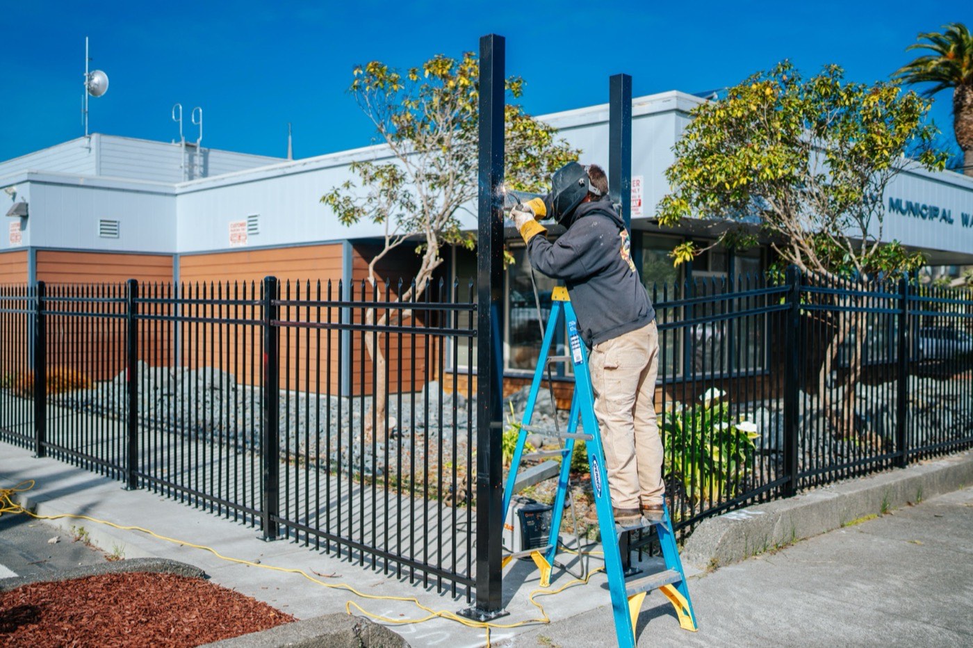 Humboldt Fence crew installing ornamental iron at a North Coast municipal building