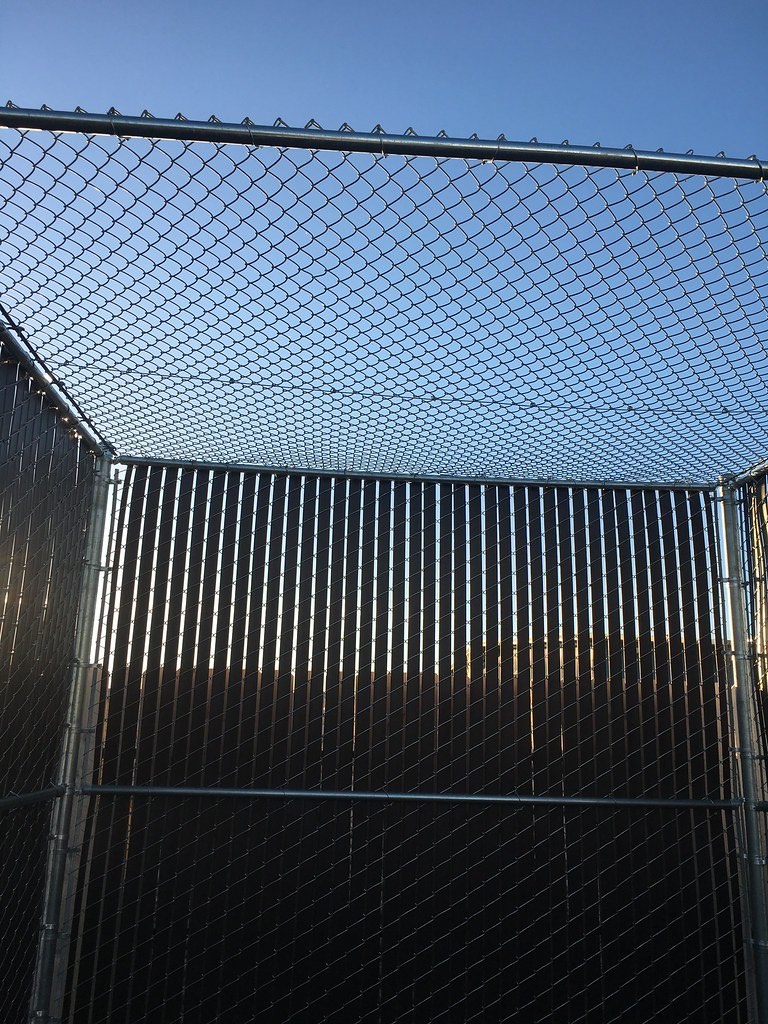 Factory-woven privacy slat chain link on a Humboldt County property