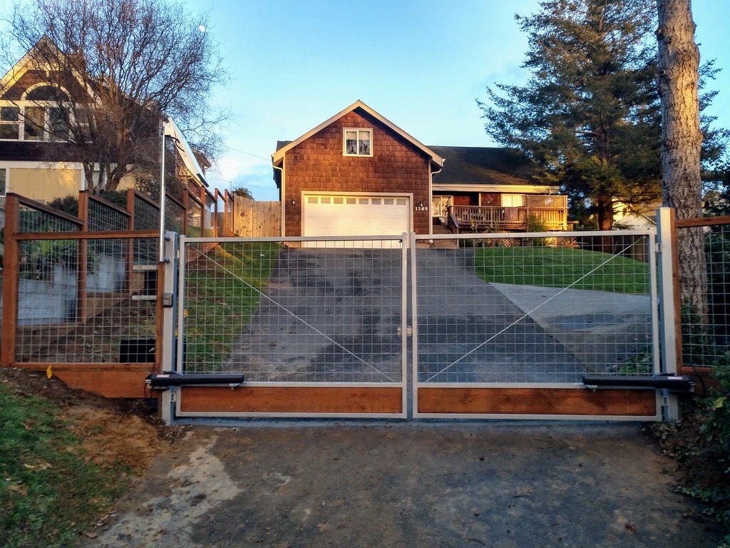 Mixed-material specialty fence combining wood and metal