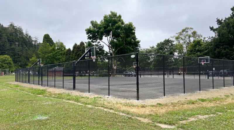 Galvanized chain link fence at a Humboldt County sports field, installed by Humboldt Fence Company