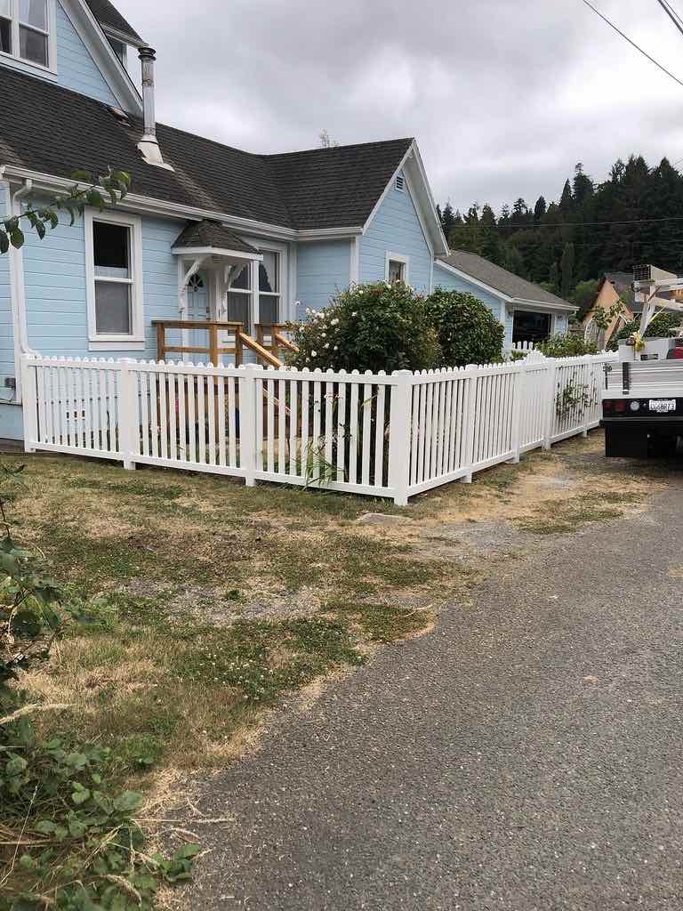 White vinyl privacy fence installed on a residential Humboldt County property