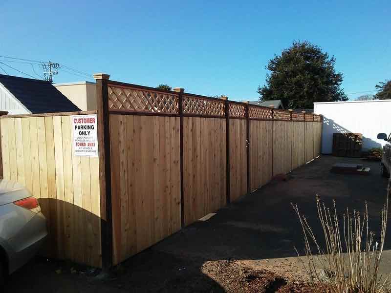 Board-on-board redwood privacy fence with lattice top, built for a Humboldt County home