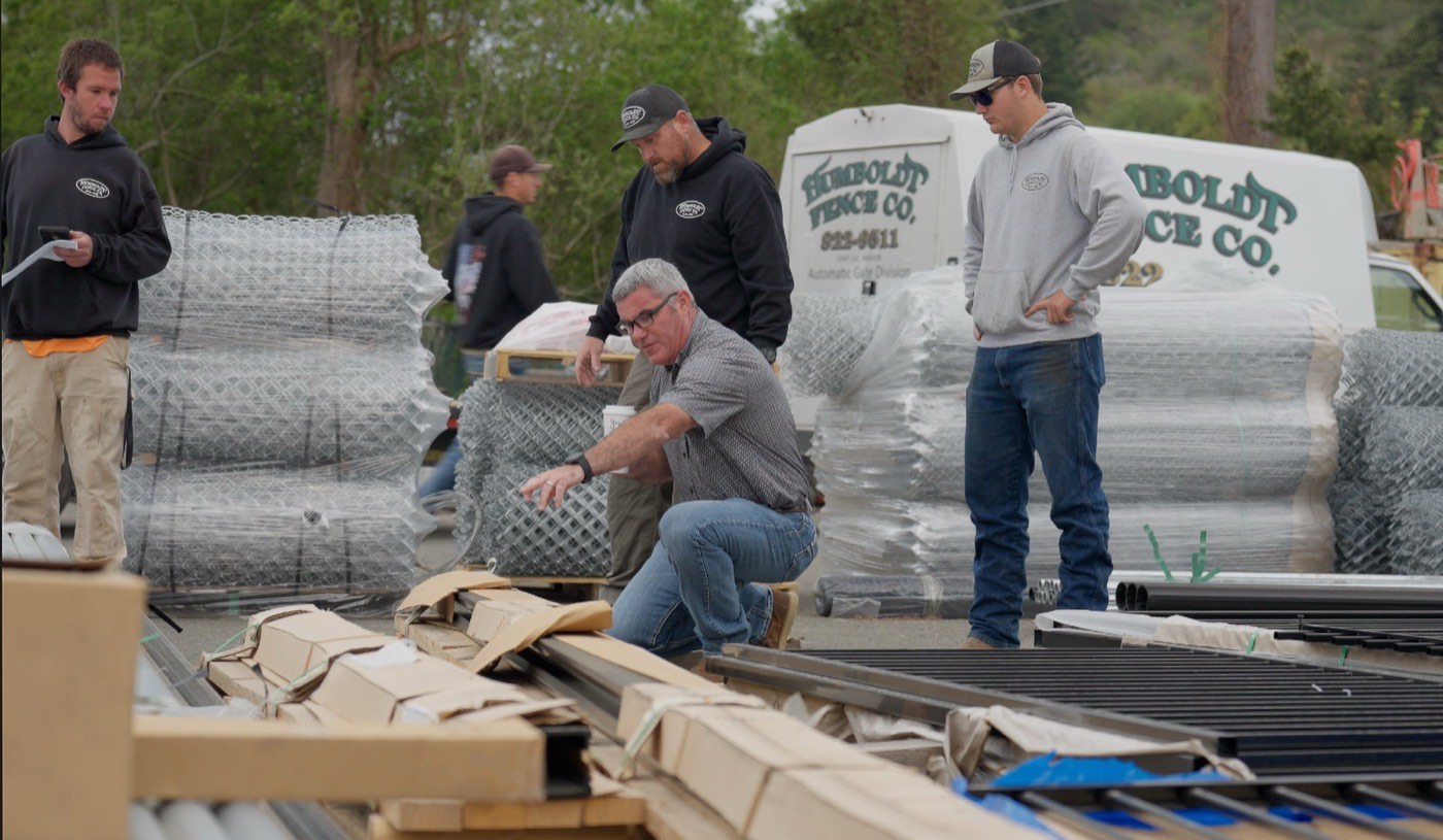 Russ Renner and the Humboldt Fence Co. crew at the Fortuna yard reviewing job materials before a commercial install